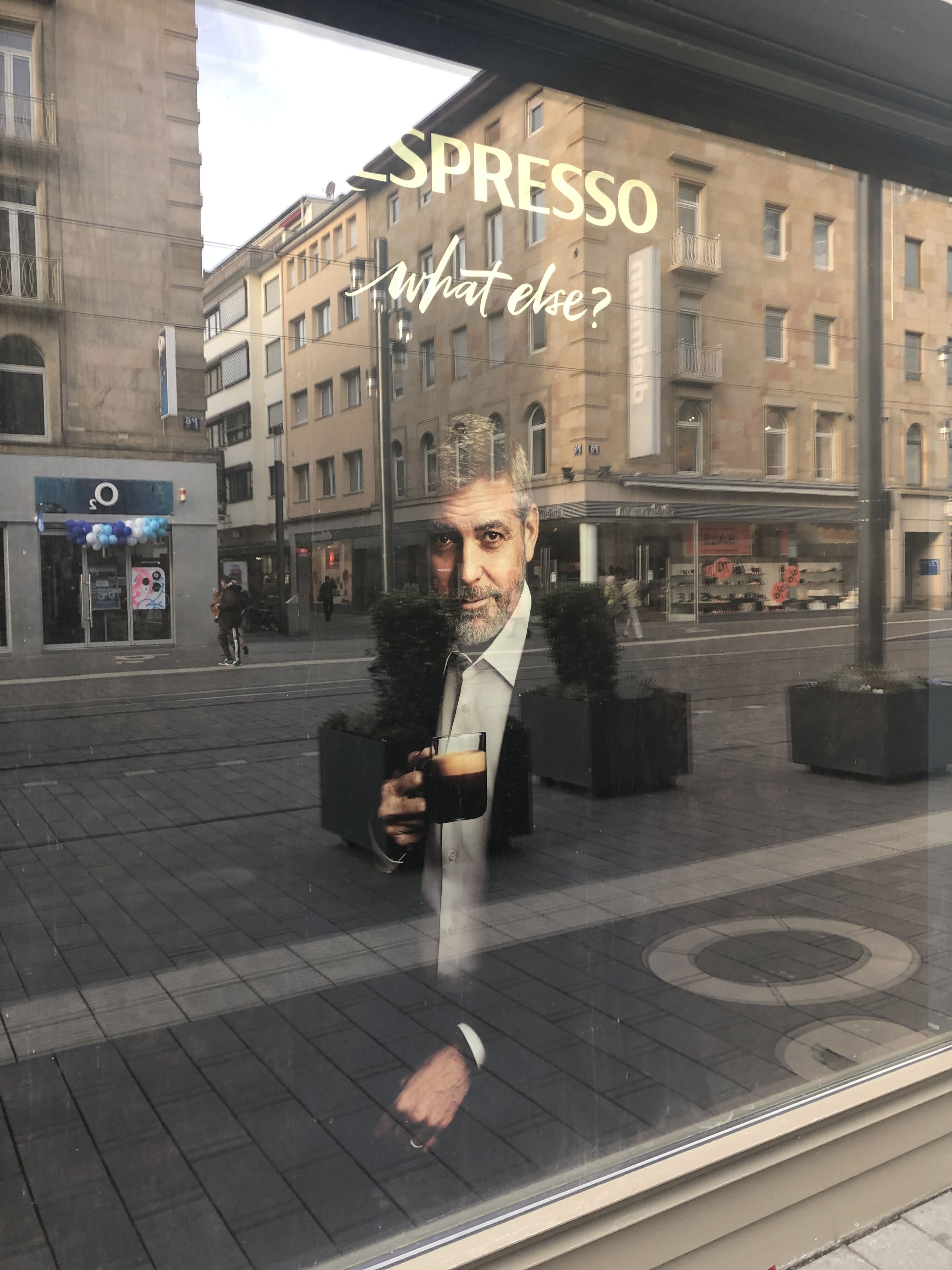 Nespresso ad with George Clooney in a shop window